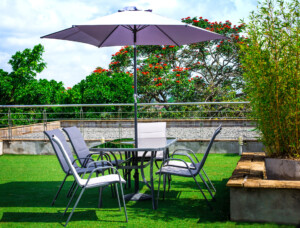 Outdoor dining table with umbrella
